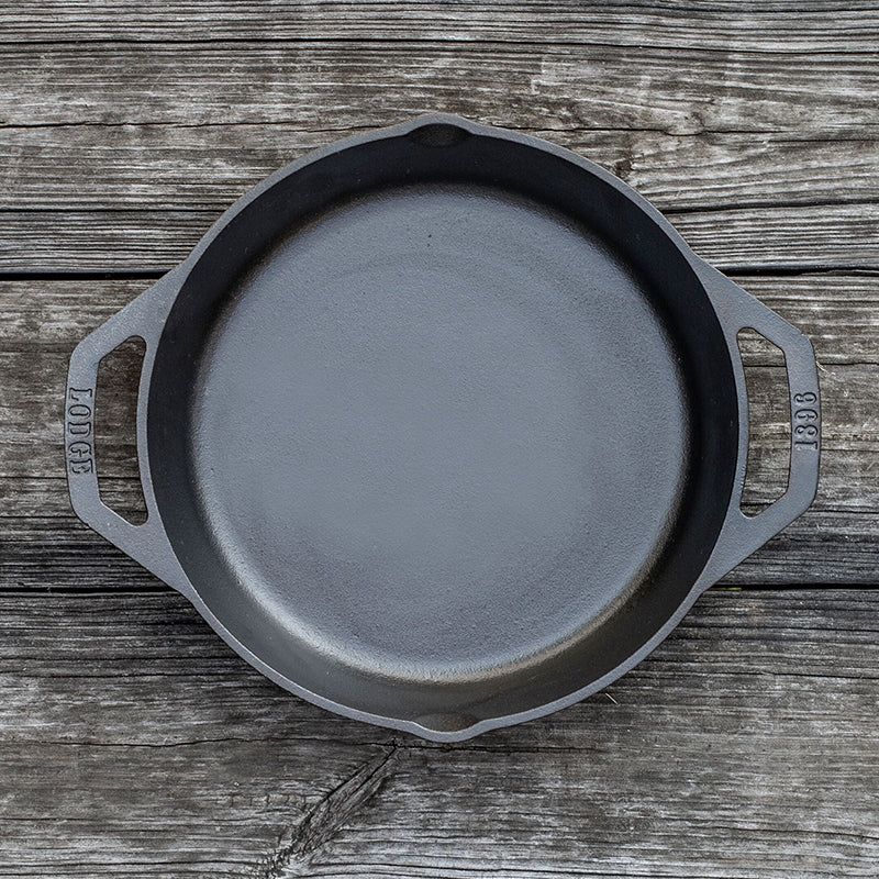 Top view of pan on wooden background.