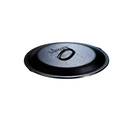 Seasoned cast iron lid with Lodge branding and handle in the middle.