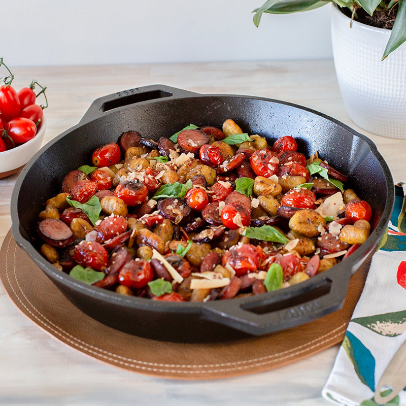 Freshly made dish with sausage, tomato's, potato's, and basil.