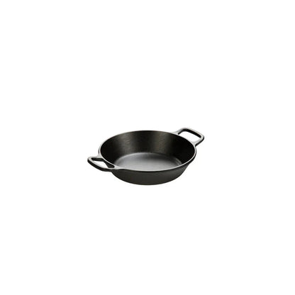 Black cast iron skillet with two loop handles.