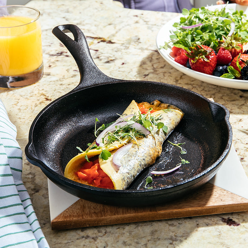 Breakfast wrap served in skillet on counter.