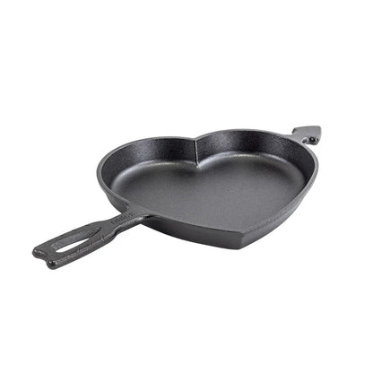 Baking pan in shape of a heart, with the handle shaped as Cupid's arrow going into it.