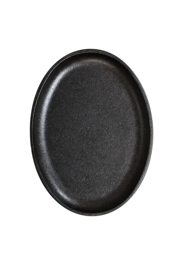 Top view of griddle, featuring cooking surface and raised edges.