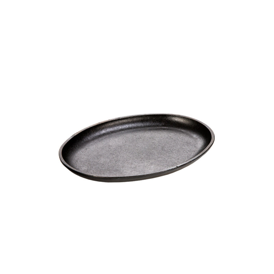 An oval-shaped, black-colored serving griddle with no handles.