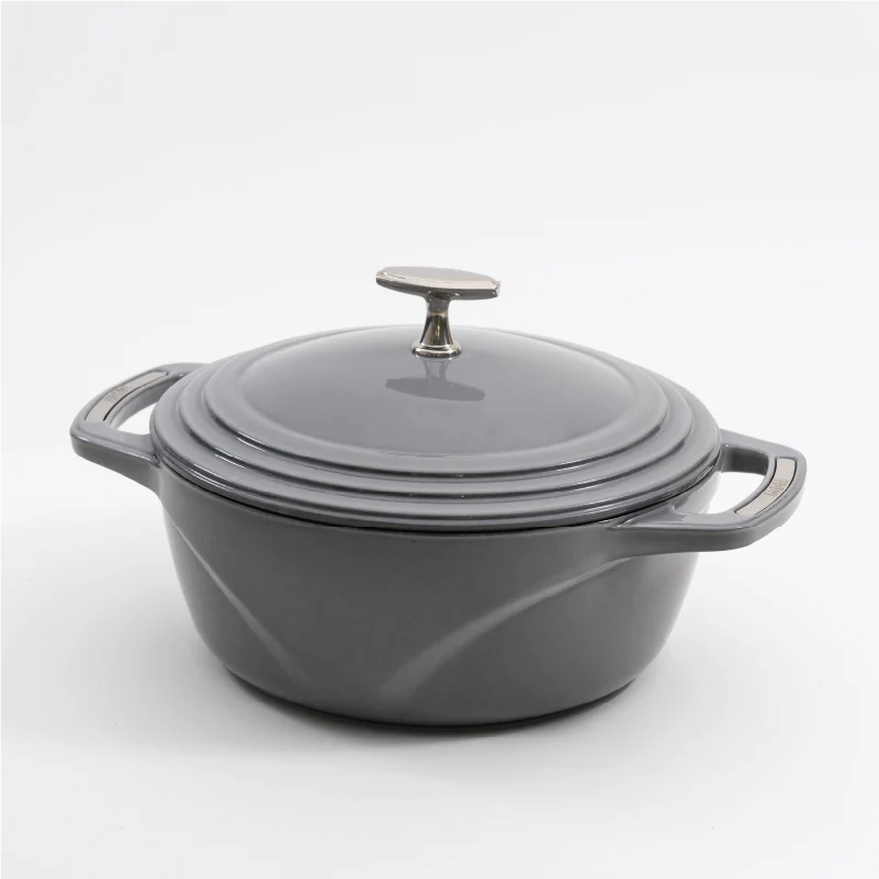 Grey enameled cast iron Dutch oven with a lid on a white background