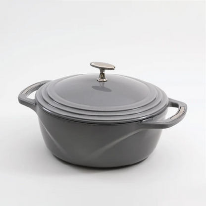 Grey enameled cast iron Dutch oven with a lid on a white background