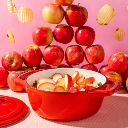 Our ladies night apple crisp recipe prepared in dutch oven with a background filled with apples and chips.
